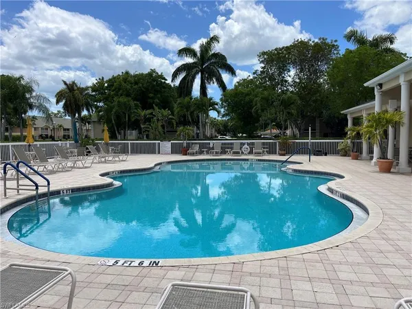 a view of a swimming pool with a patio