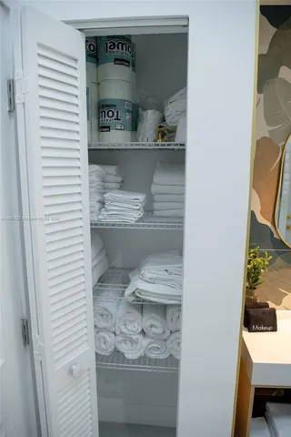 a bathroom with a sink mirror and vanity