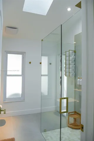 a bedroom with two beds and a window