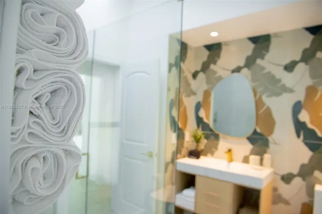 a view of a dining room with furniture and a potted plant
