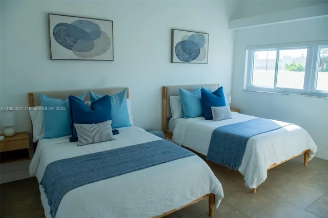 a bedroom with a bed and lamp