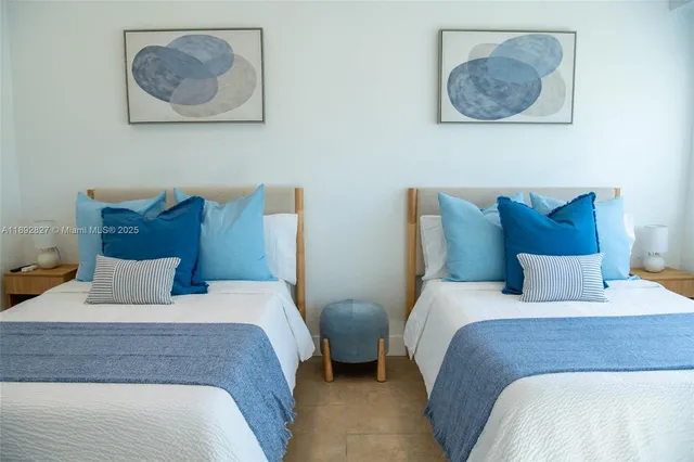 a bedroom with a bed and a potted plant