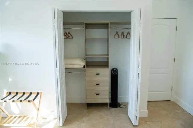 a bathroom with a shower and toilet