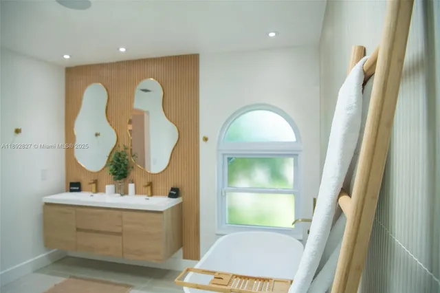 a utility room with sink dryer and washer