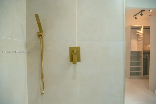 a living room with furniture pool table and potted plants