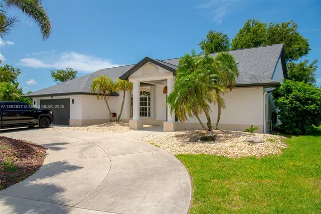 a large bed sitting in a bedroom next to a window