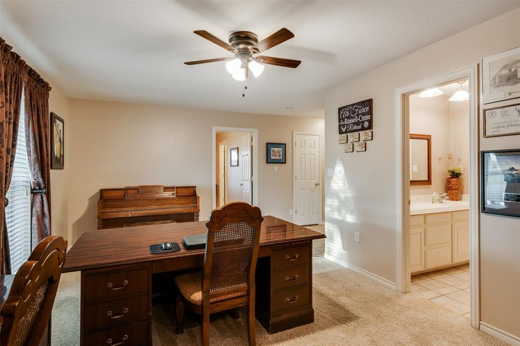 6101 Kovarik Road Wichita Falls, TX 76310 - Photo 25 of 40 a workspace with furniture and chandelier