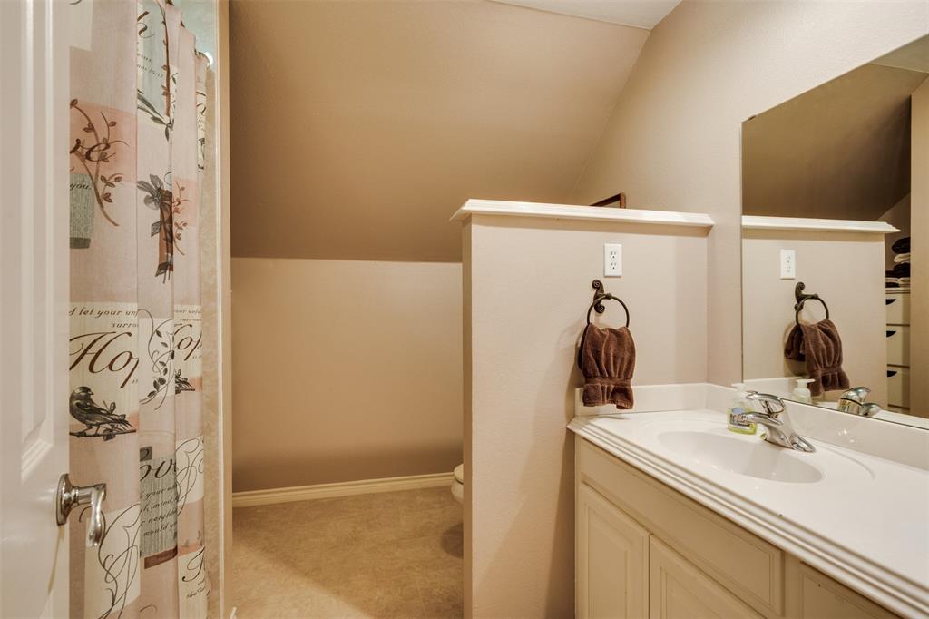 6101 Kovarik Road Wichita Falls, TX 76310 - Photo 30 of 40 a bathroom with a sink and a mirror
