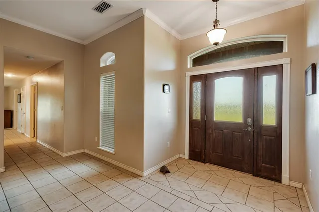 a view of a hallway with wooden shelves