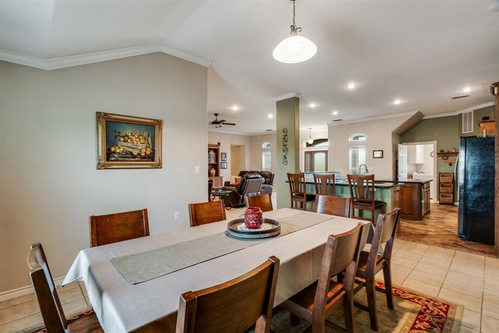 6101 Kovarik Road Wichita Falls, TX 76310 - Photo 6 of 40 a kitchen and a dining room with furniture and a chandelier