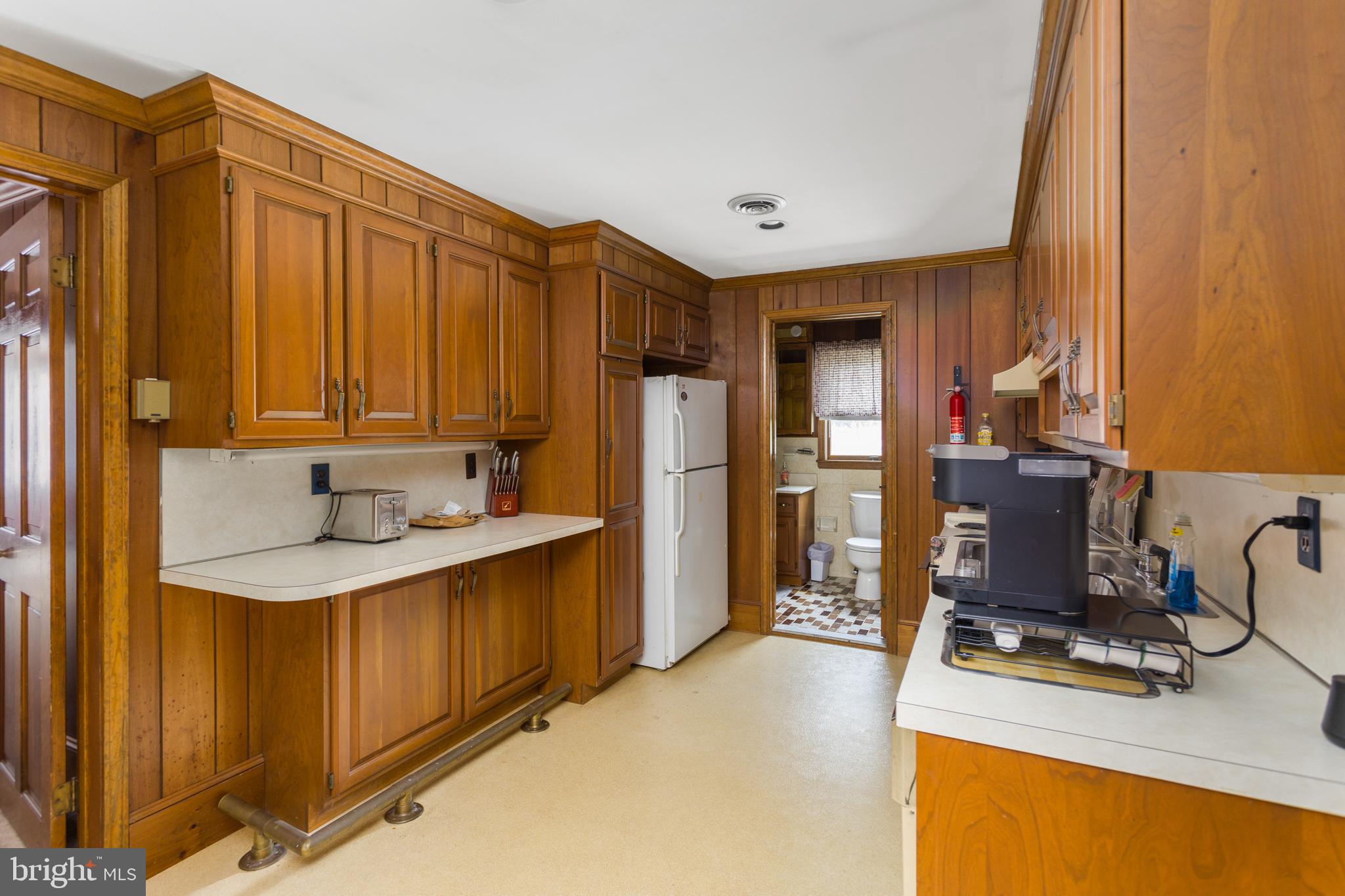 16 Archertown Road, Unit A New Egypt, NJ 08533 - Photo 2 of 13 a view of a kitchen with a sink a refrigerator and a stove top oven