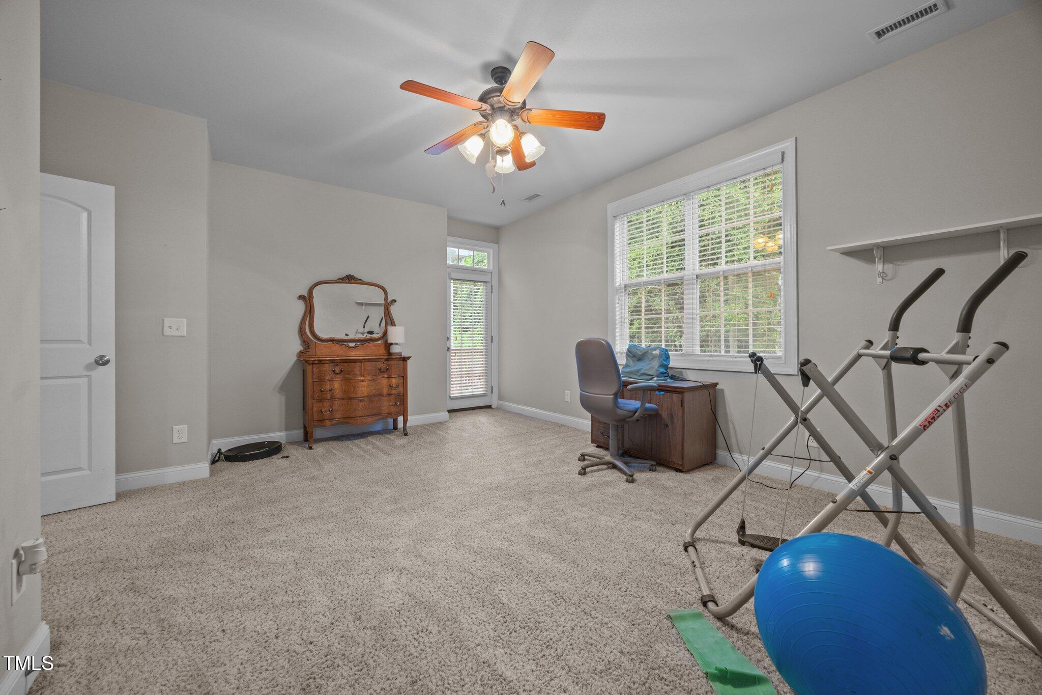 8116 Mosby Way Willow Spring, NC 27592 - Photo 25 of 43 Main Floor Bonus Room w access to deck.