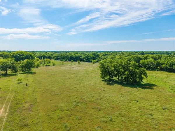 a view of a lake with a big yard