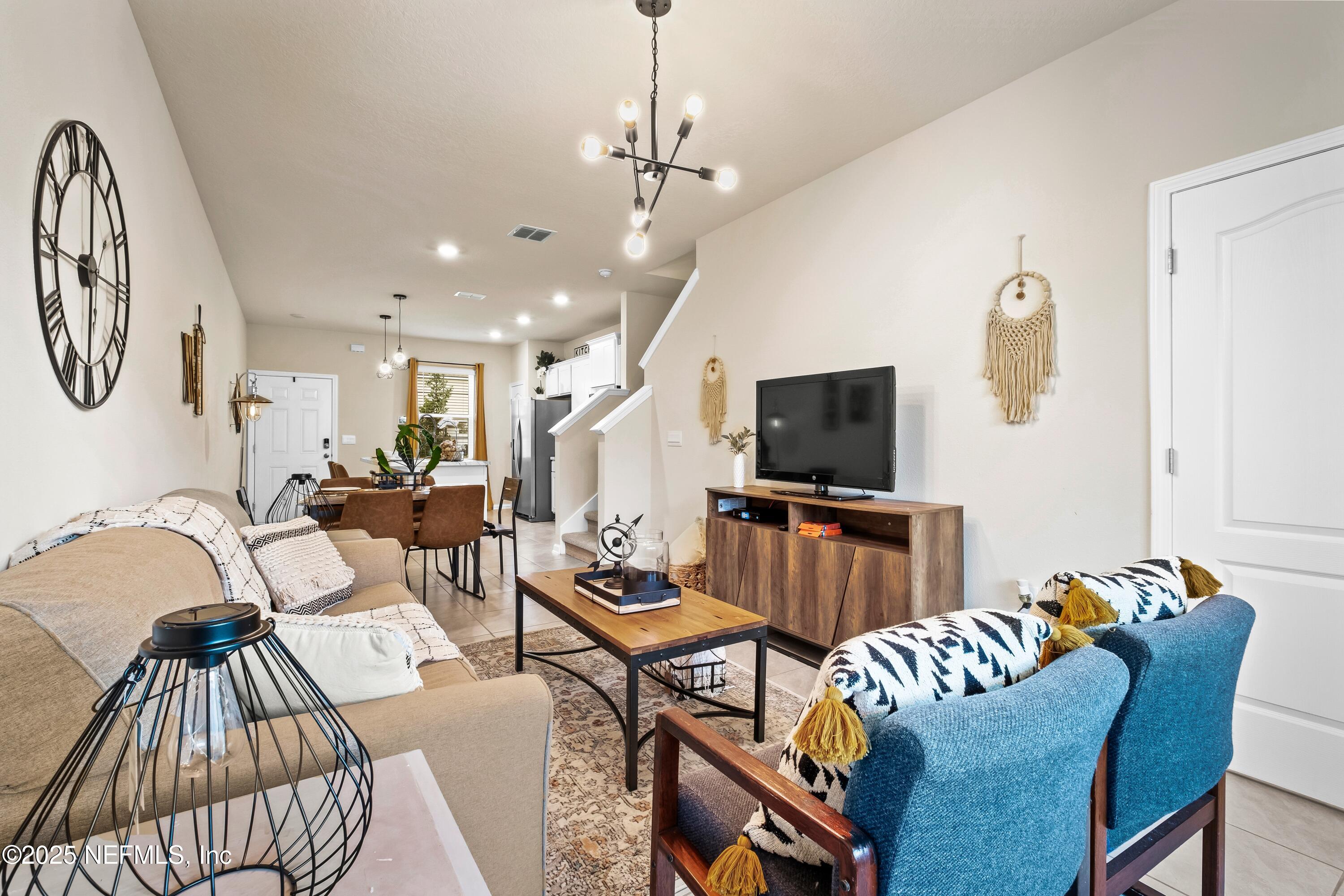 4920 Earthshine Road Jacksonville, FL 32256 - Photo 15 of 16 a living room with furniture and a flat screen tv