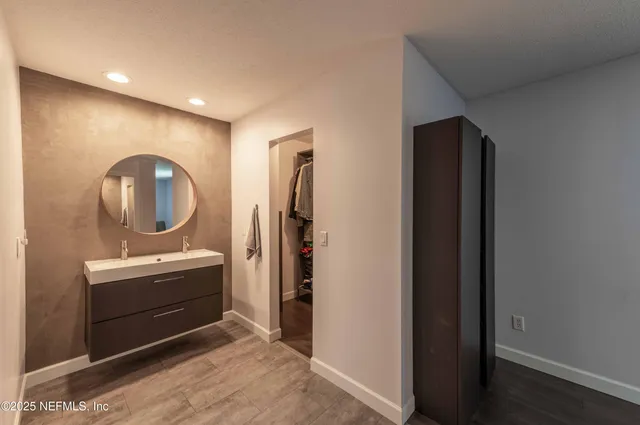 a work room with furniture and wooden floor