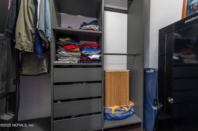 a kitchen with a sink cabinets and stainless steel appliances