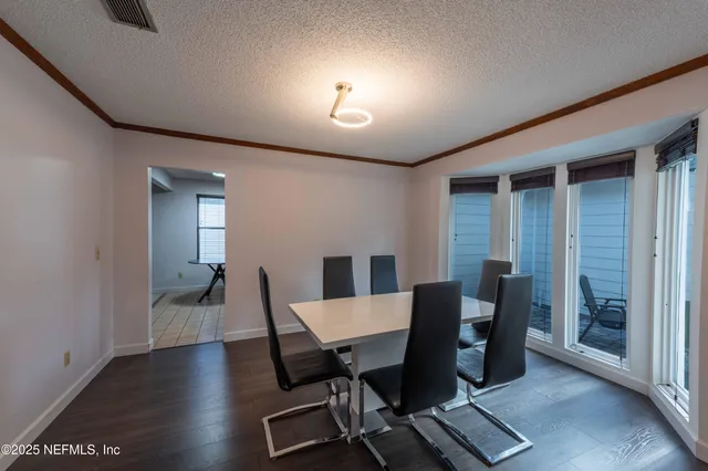 a kitchen with stainless steel appliances a stove a sink and cabinets