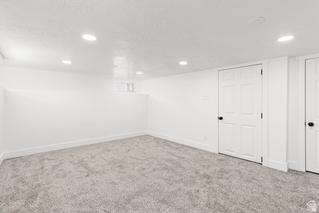 372 East 400 North Springville, UT 84663 - Photo 19 of 27 Recessed lighting, plush carpeting, white trim, and a six-panel door