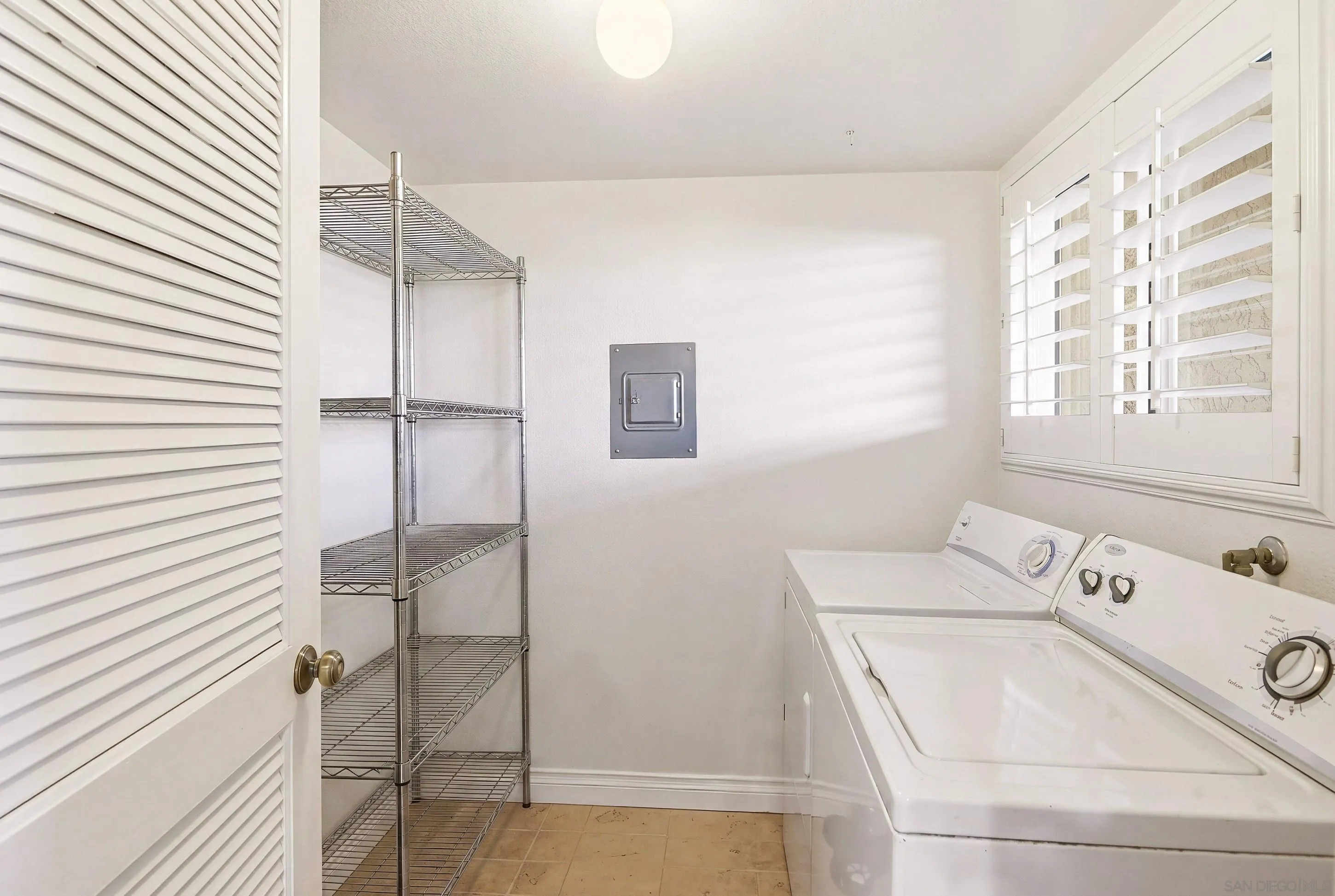 17443 Ashburton Road San Diego, CA 92128 - Photo 12 of 36 a bathroom with a bathtub and shower