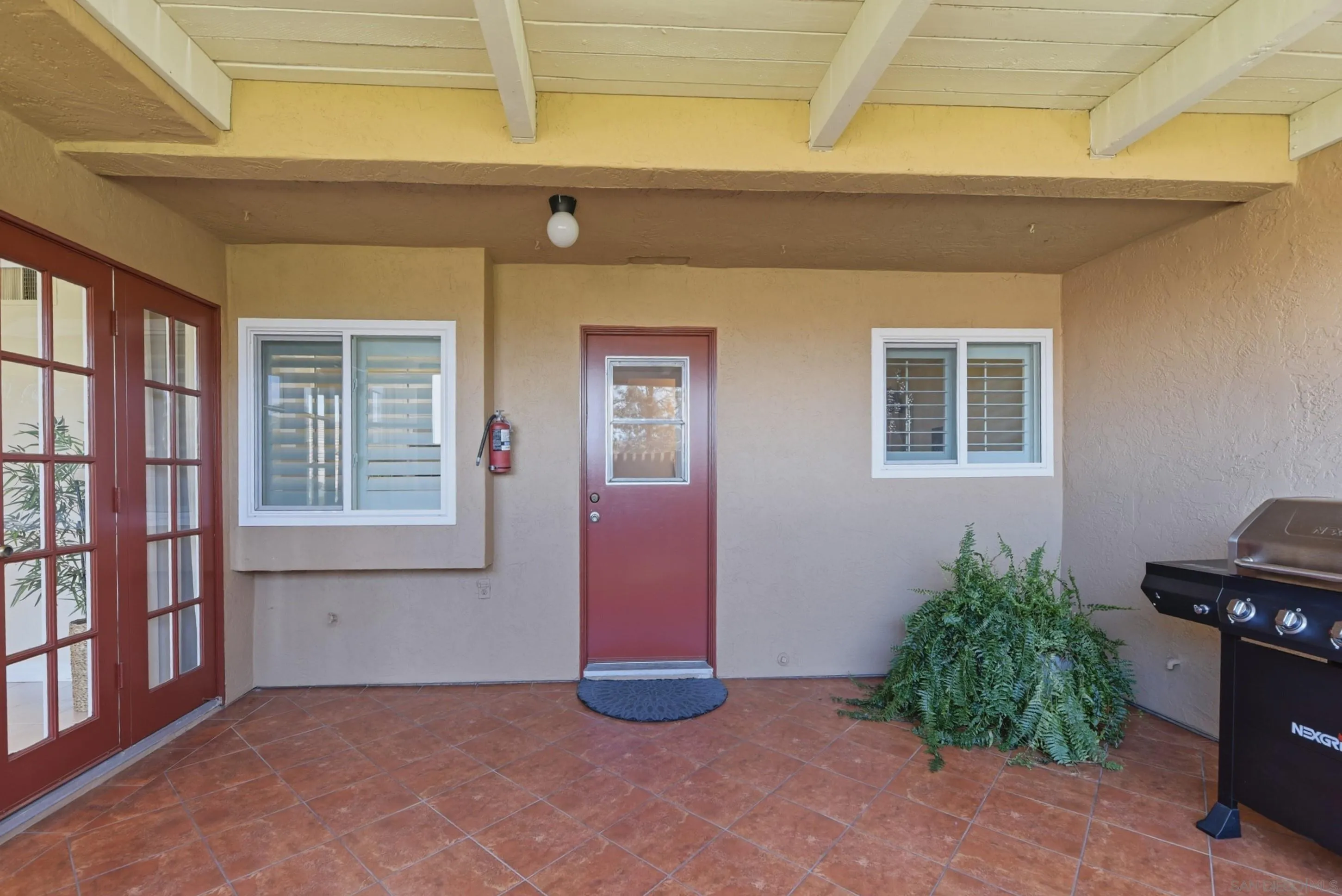 17443 Ashburton Road San Diego, CA 92128 - Photo 14 of 36 a view of an empty room with a window