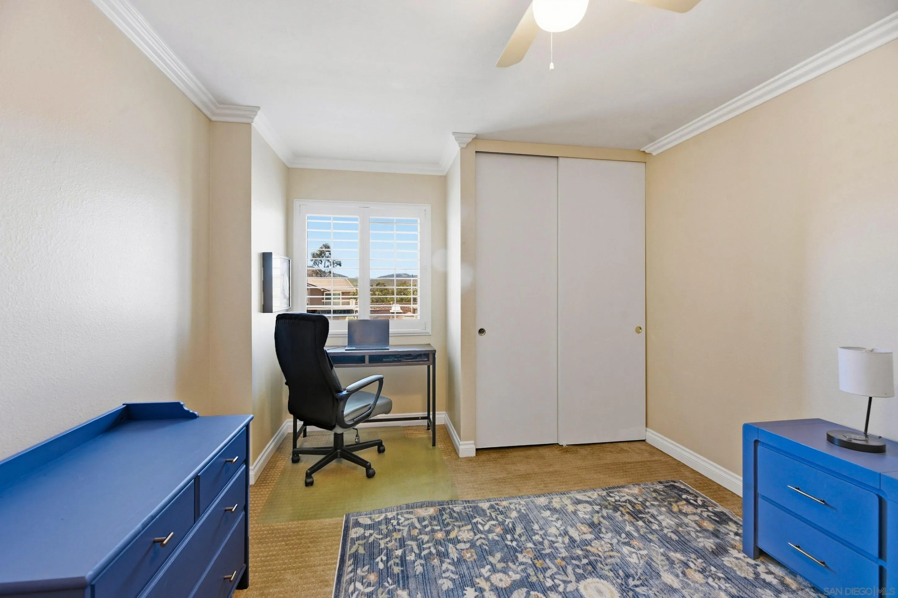 17443 Ashburton Road San Diego, CA 92128 - Photo 17 of 36 a view of a workspace with furniture and a window