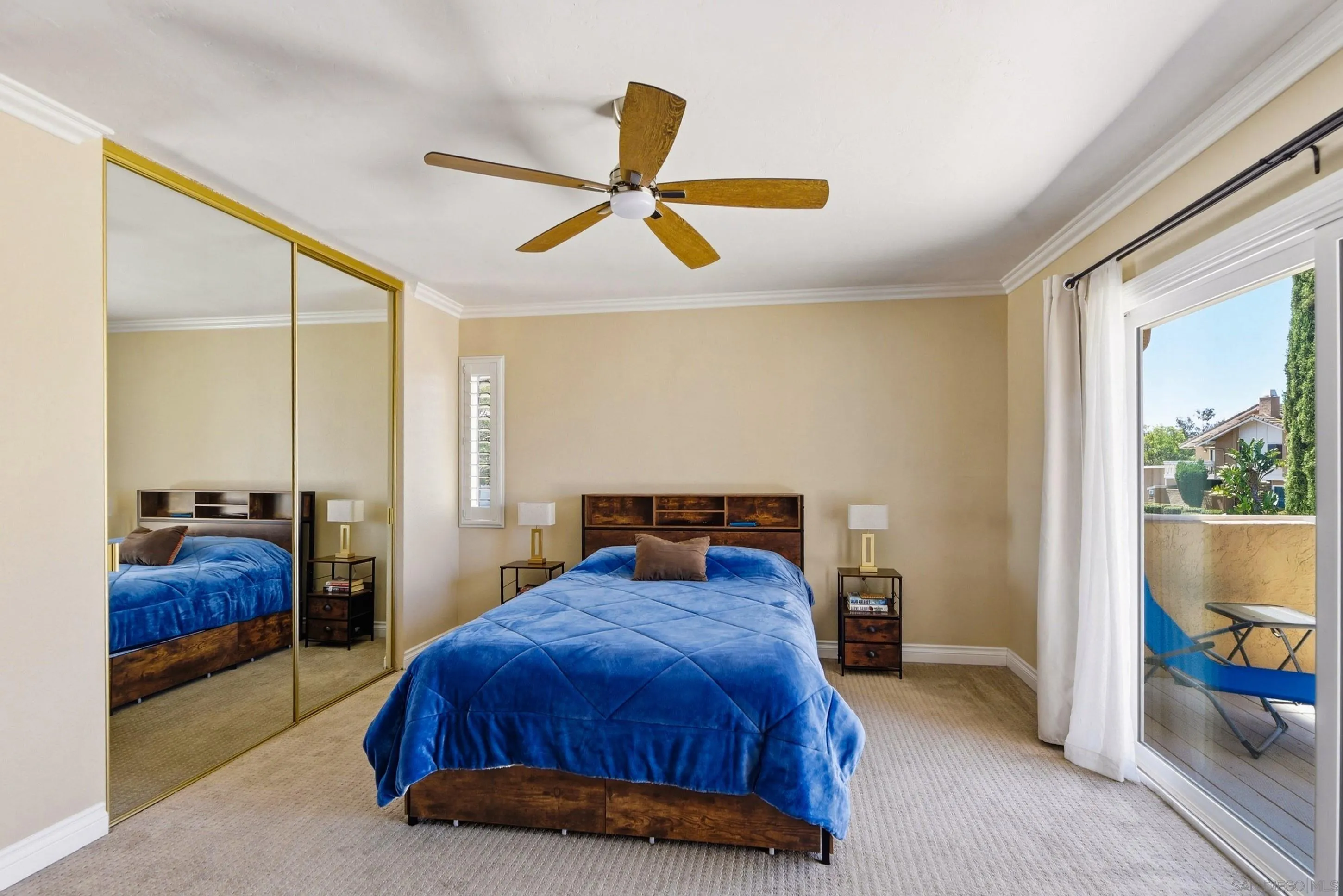 17443 Ashburton Road San Diego, CA 92128 - Photo 19 of 36 a bedroom with a bed and balcony