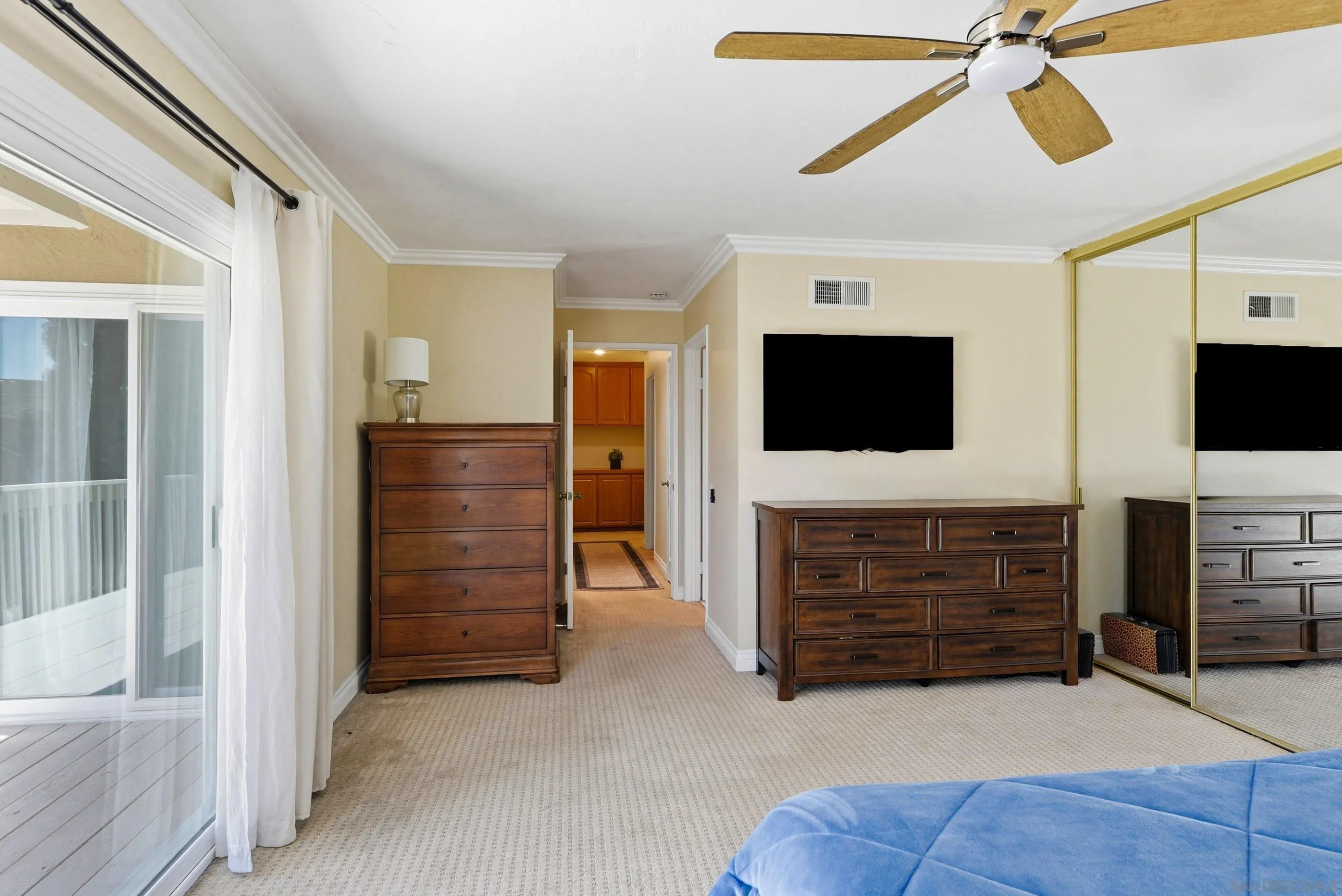 17443 Ashburton Road San Diego, CA 92128 - Photo 20 of 36 a view of an empty room with furniture and a flat screen tv