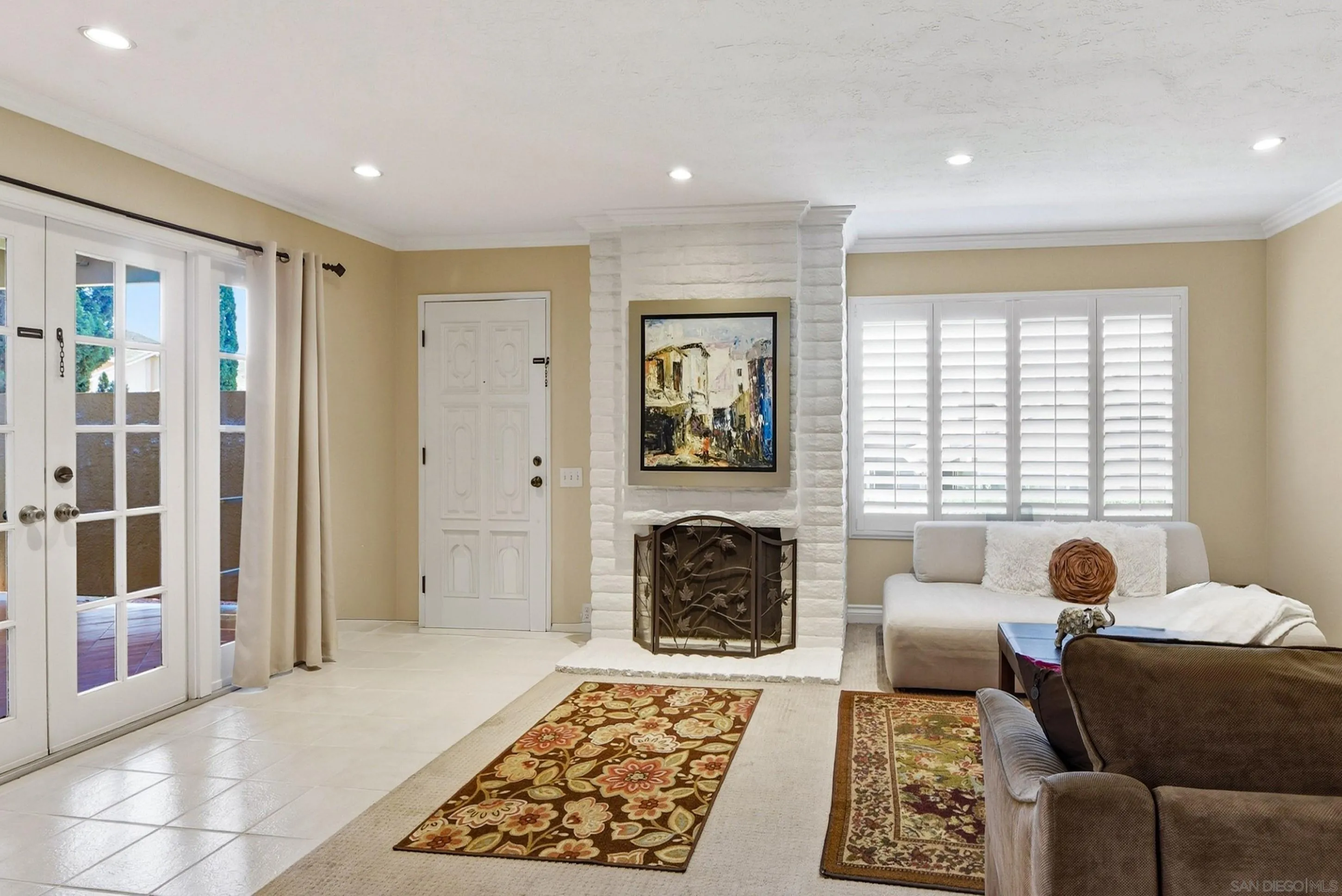 17443 Ashburton Road San Diego, CA 92128 - Photo 2 of 36 a living room with furniture and a rug