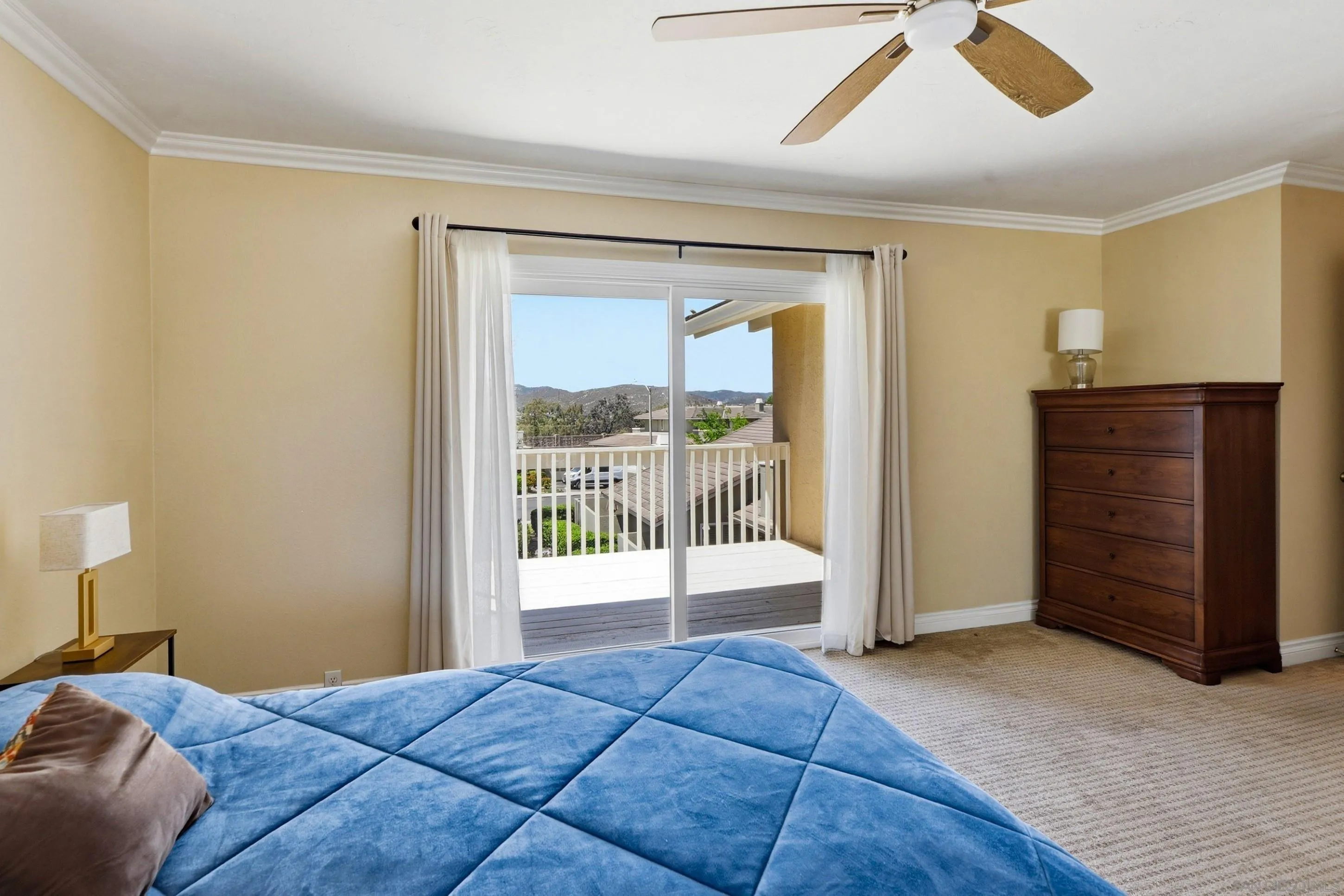 17443 Ashburton Road San Diego, CA 92128 - Photo 21 of 36 a bed room with a bed and a chair