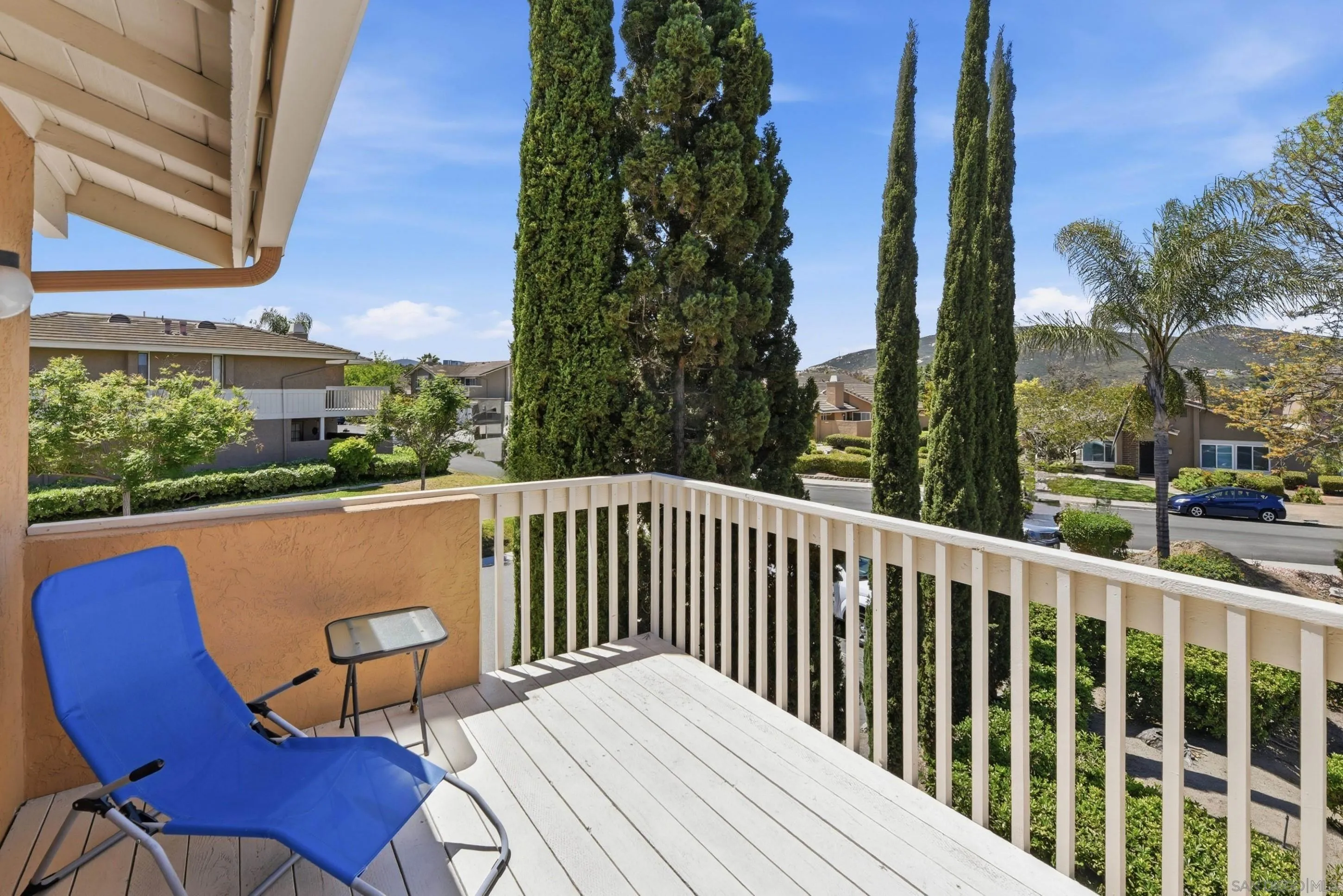 17443 Ashburton Road San Diego, CA 92128 - Photo 23 of 36 a balcony with wooden floor table and chairs