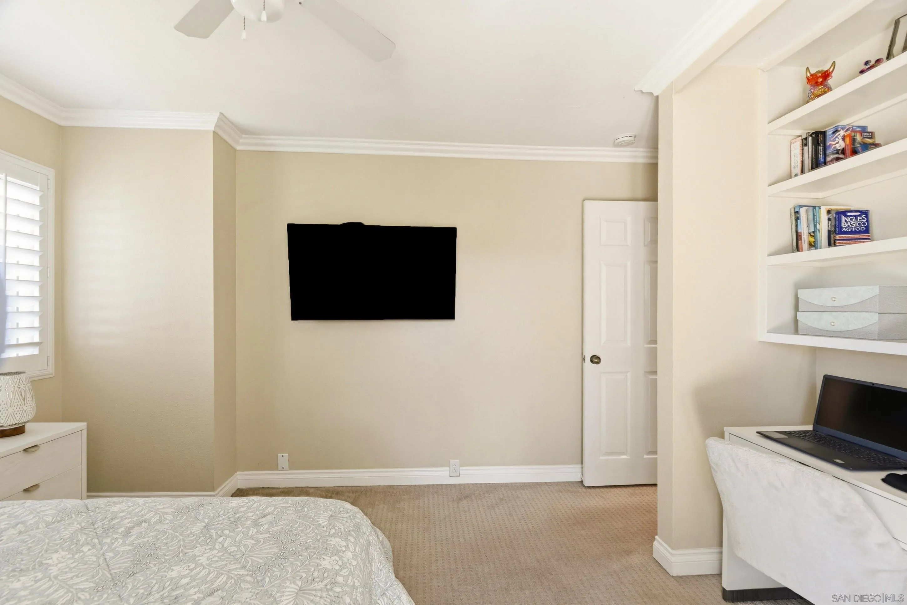 17443 Ashburton Road San Diego, CA 92128 - Photo 28 of 36 a bedroom with a bed and a flat screen tv
