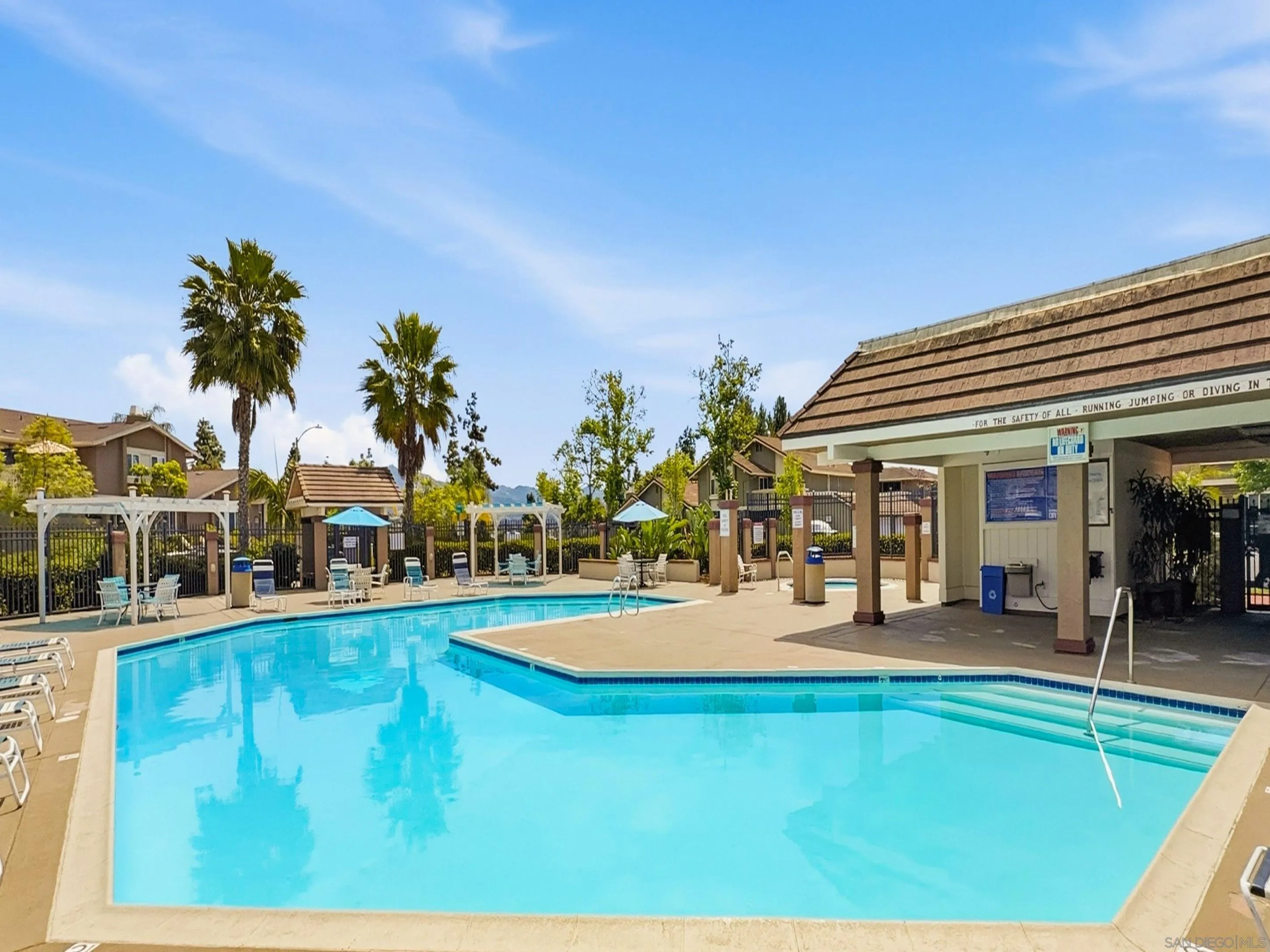 17443 Ashburton Road San Diego, CA 92128 - Photo 33 of 36 a view of a swimming pool with an outdoor seating