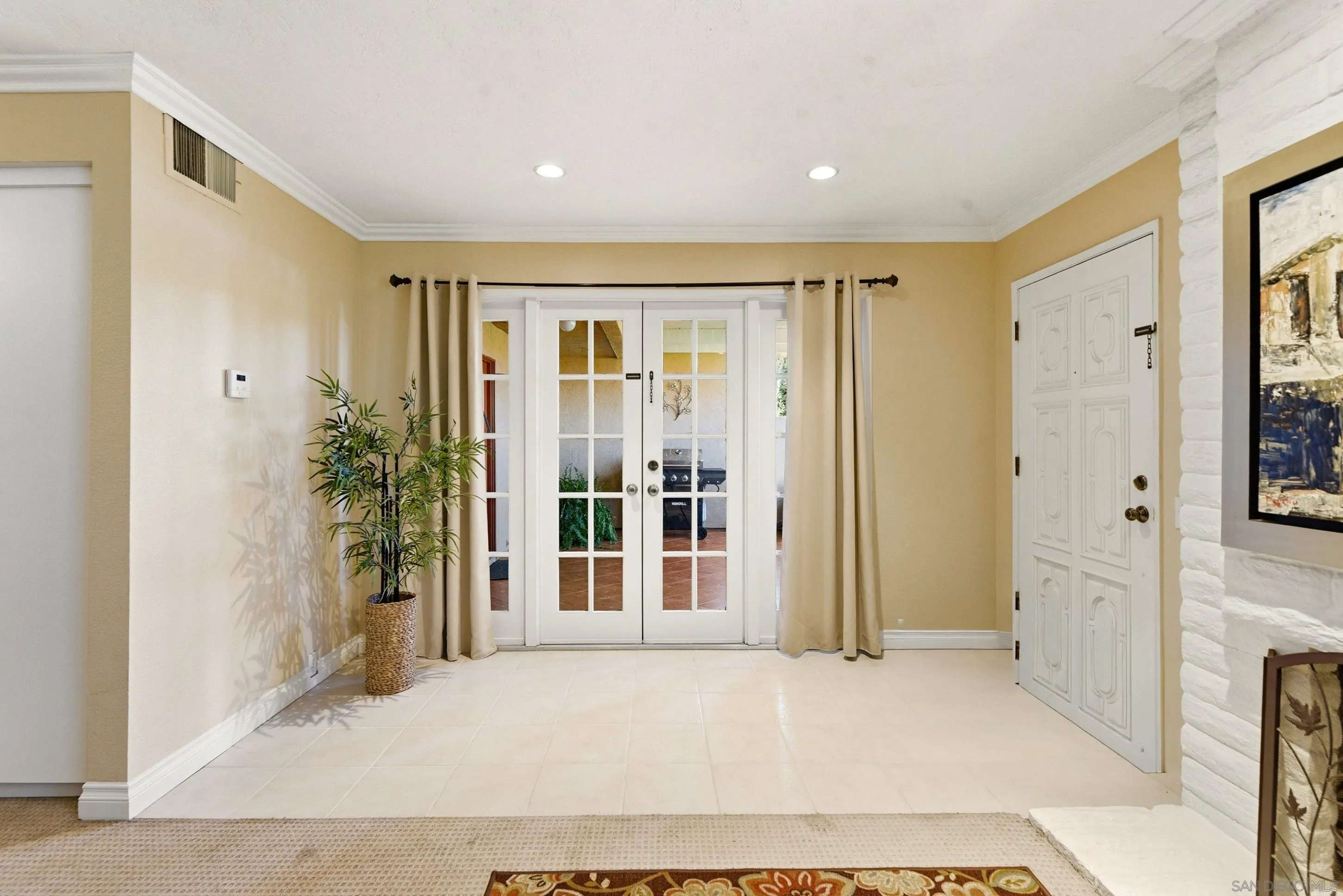 17443 Ashburton Road San Diego, CA 92128 - Photo 4 of 36 an empty room with windows and entrance