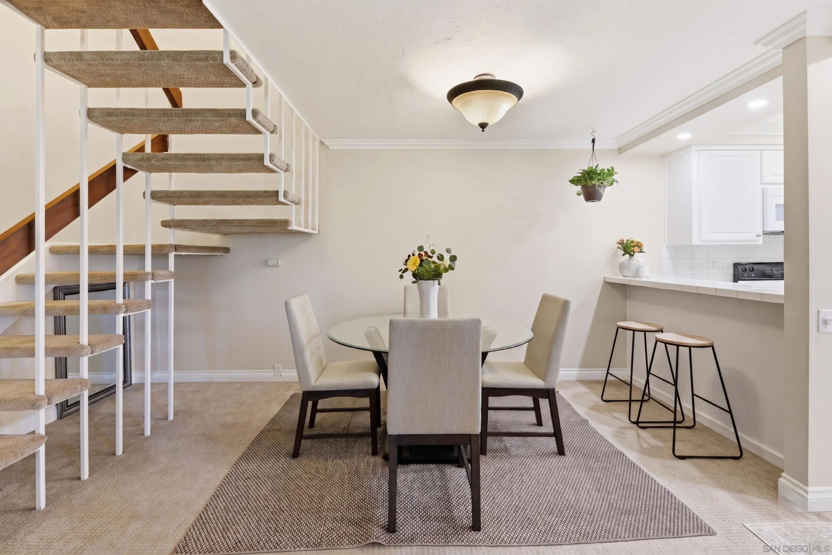 17443 Ashburton Road San Diego, CA 92128 - Photo 5 of 36 a view of a dining room with furniture and wooden floor