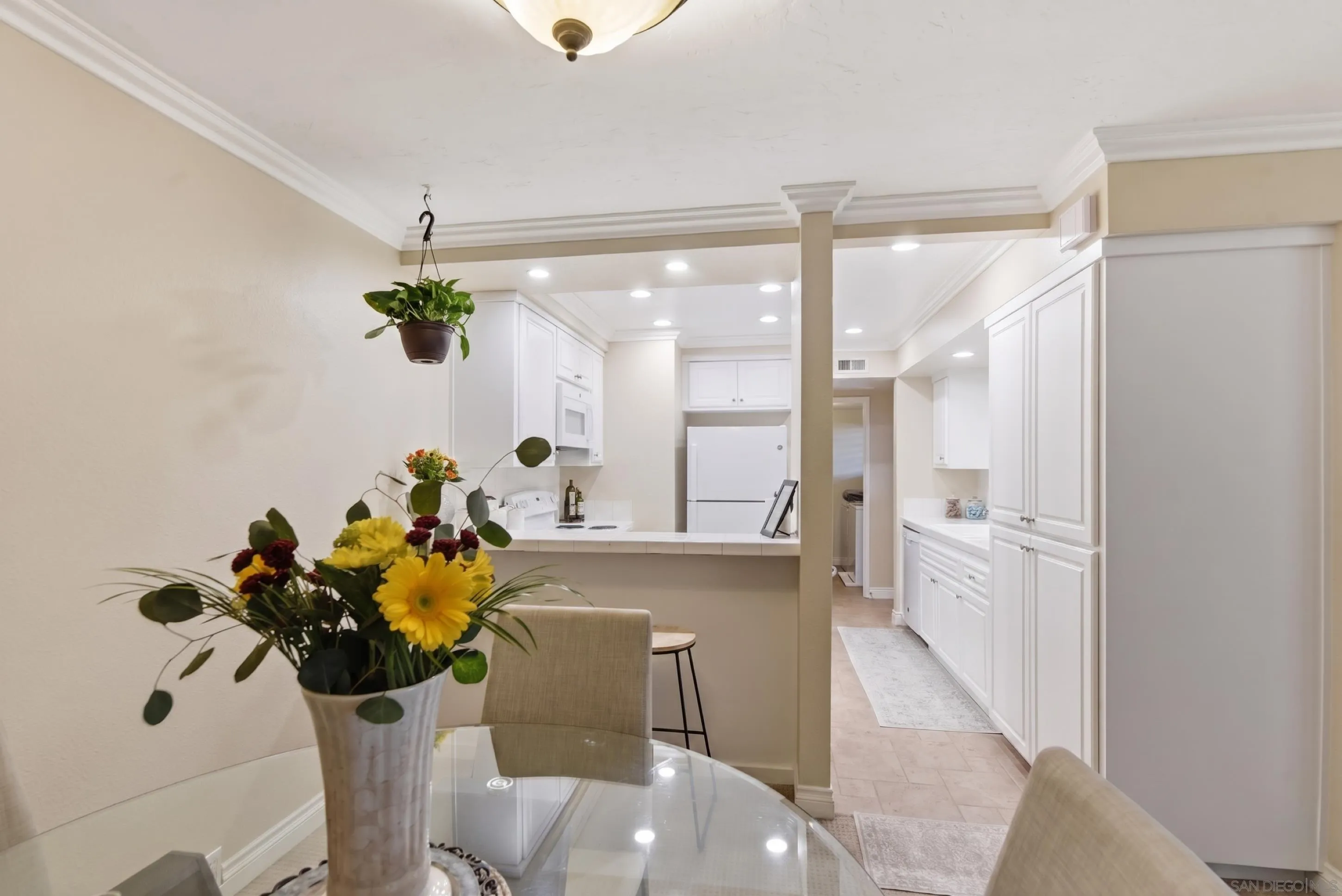17443 Ashburton Road San Diego, CA 92128 - Photo 7 of 36 a dining room with furniture and chandelier