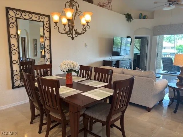 a view of a dining room with furniture and window