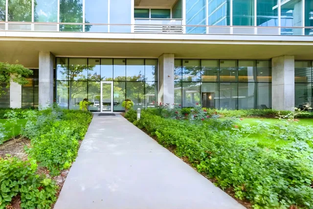 a view of a room with wooden floor and a window