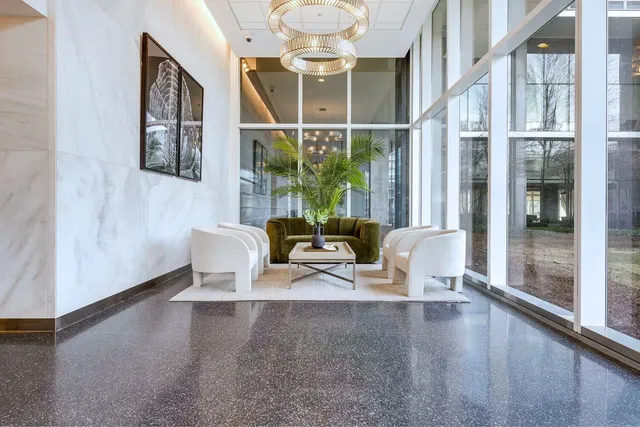 a large kitchen with granite countertop a large window and a sink