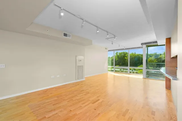 a room with gym equipment and floor to ceiling window