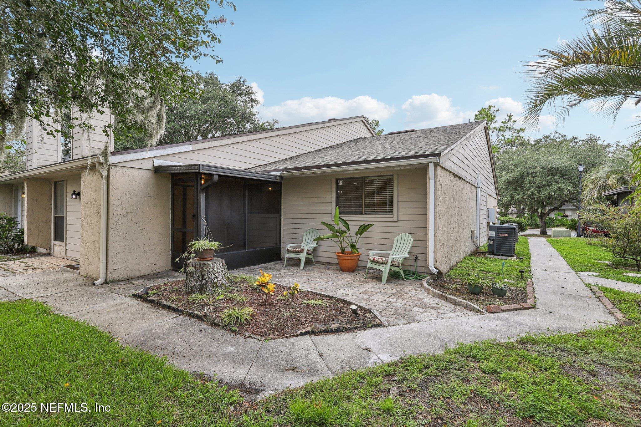 3801 Crown Point Road, Unit 2024 Jacksonville, FL 32257 - Photo 24 of 36 a front view of a house with garden