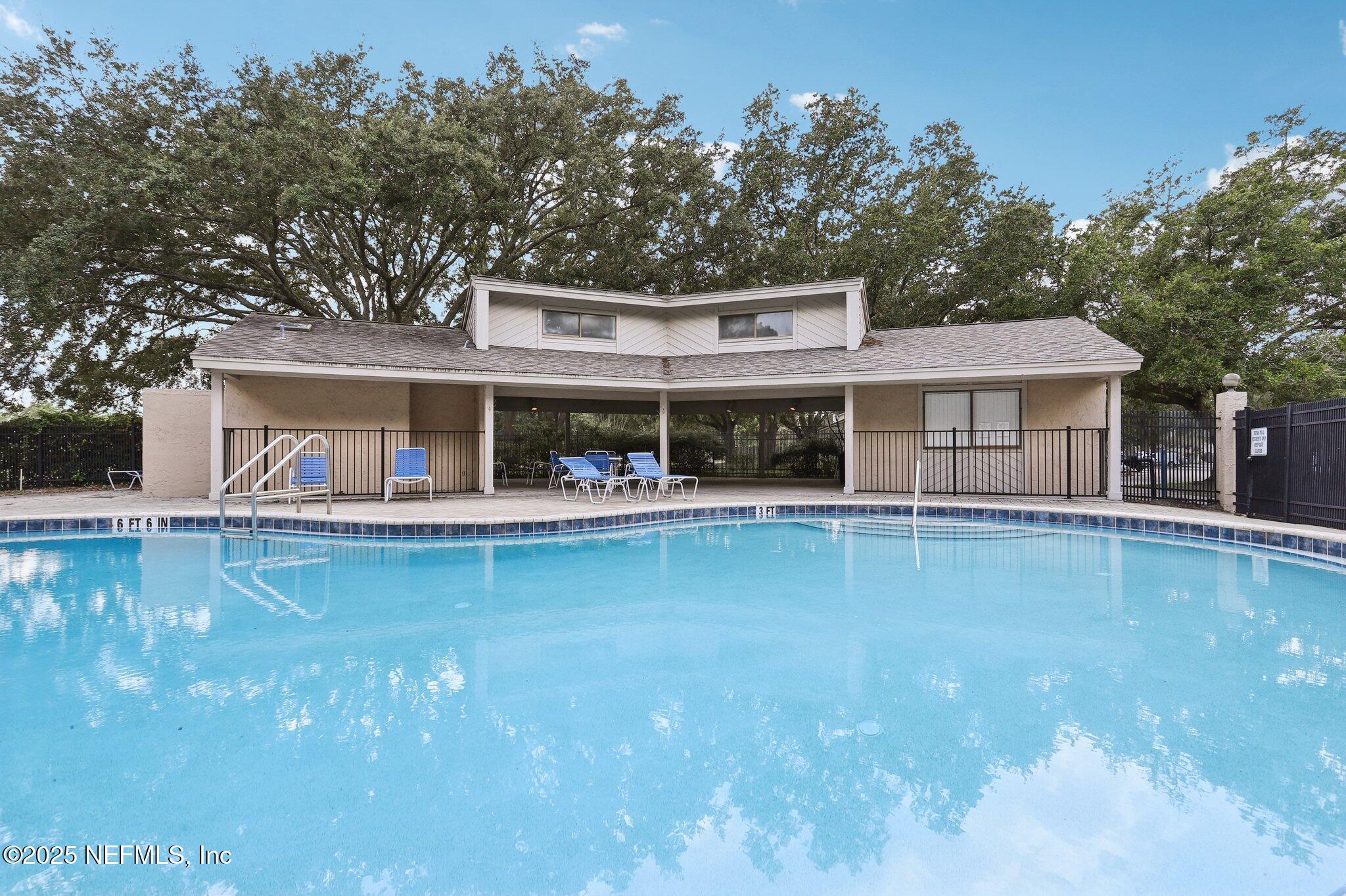 3801 Crown Point Road, Unit 2024 Jacksonville, FL 32257 - Photo 29 of 36 front view of a house with a swimming pool