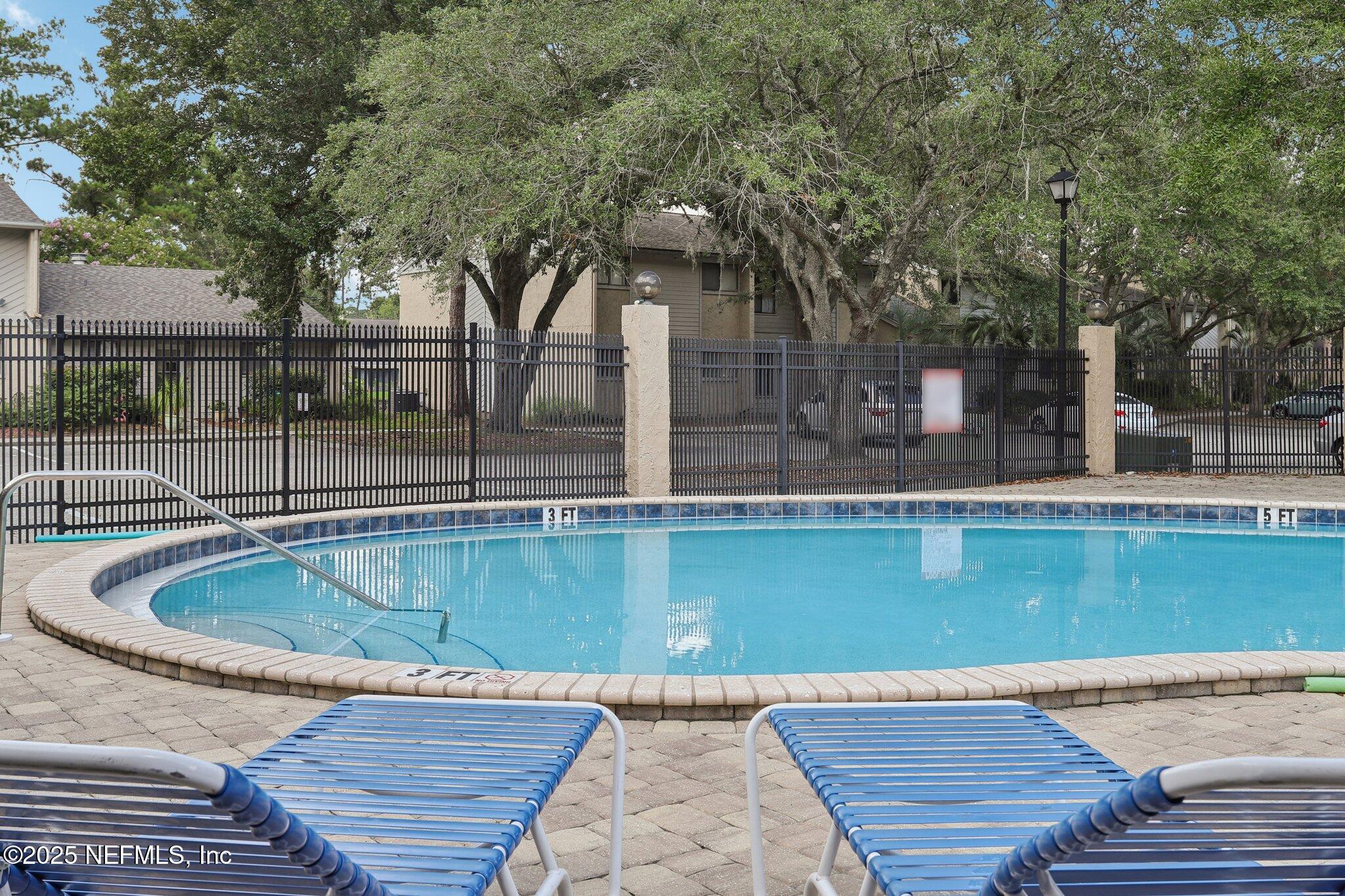 3801 Crown Point Road, Unit 2024 Jacksonville, FL 32257 - Photo 32 of 36 a view of outdoor space swimming pool and outdoor seating