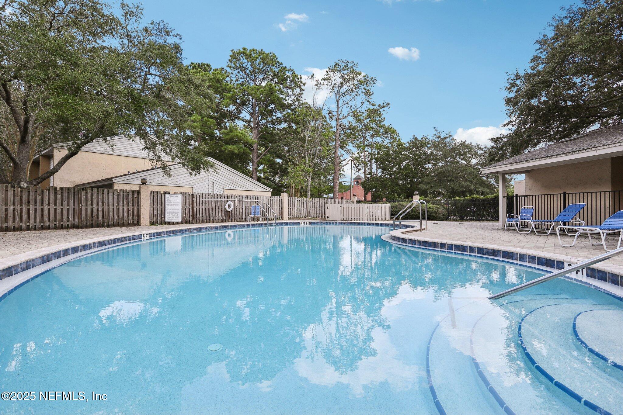 3801 Crown Point Road, Unit 2024 Jacksonville, FL 32257 - Photo 33 of 36 a view of a house with swimming pool