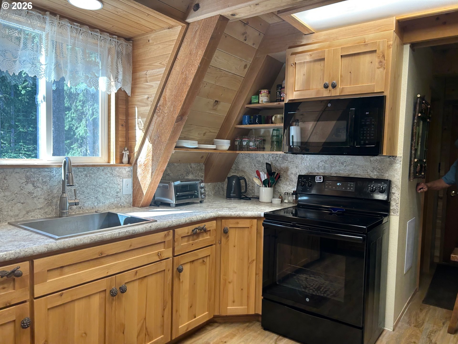 77120 Spout Springs Road Weston, OR 97886 - Photo 15 of 37 a kitchen with stainless steel appliances granite countertop a stove and a sink