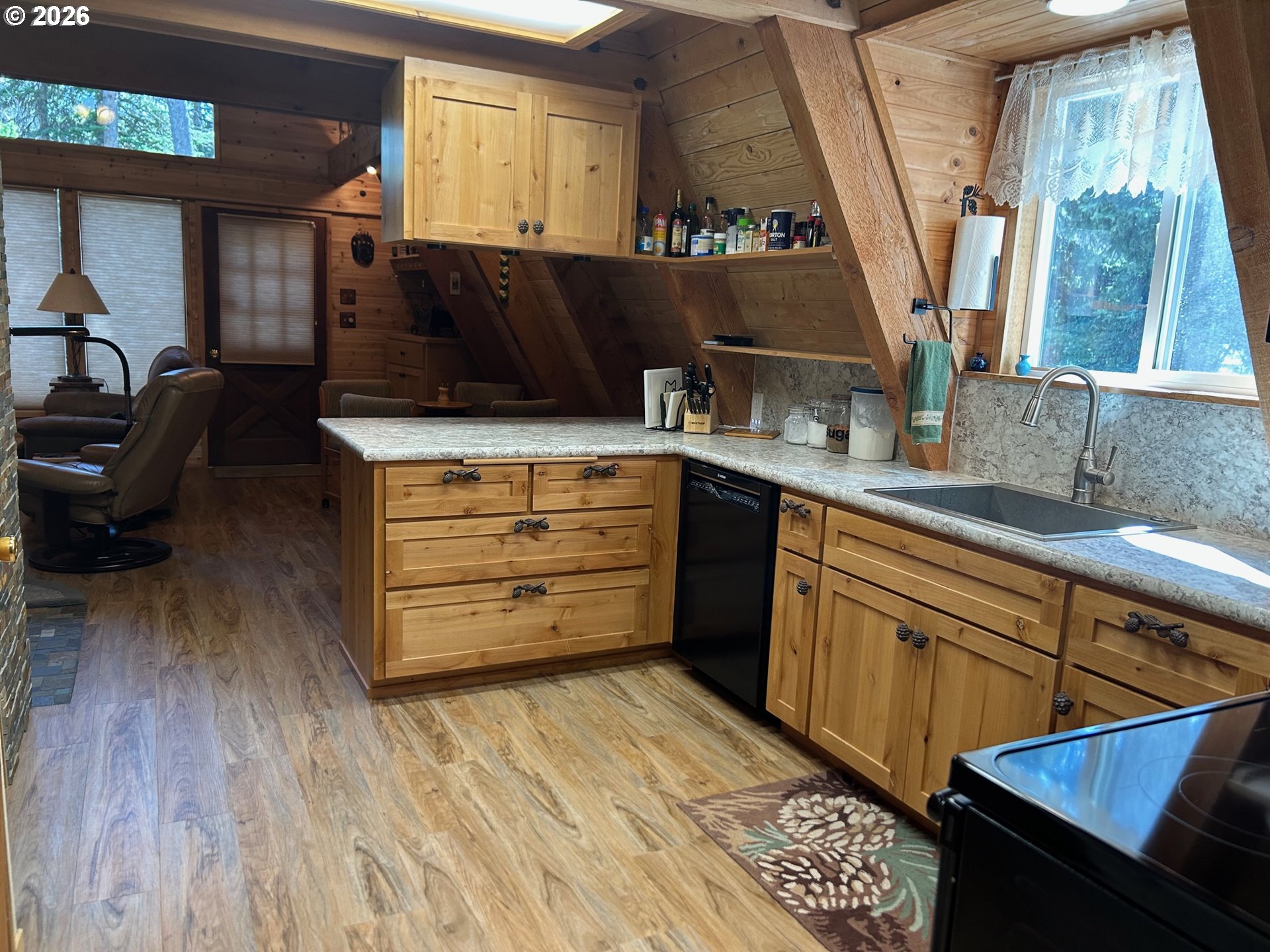 77120 Spout Springs Road Weston, OR 97886 - Photo 16 of 37 a kitchen with a wooden floor and a sink