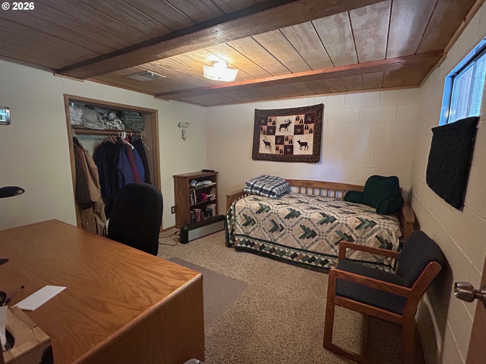 77120 Spout Springs Road Weston, OR 97886 - Photo 25 of 37 a bedroom with bed and a flat screen tv