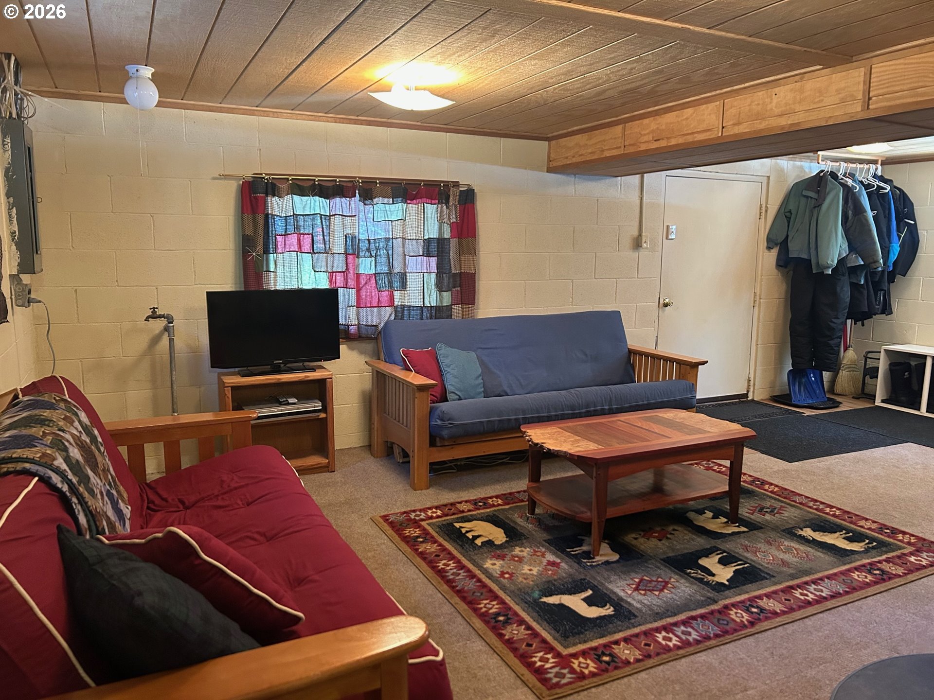 77120 Spout Springs Road Weston, OR 97886 - Photo 27 of 37 a living room with furniture and a flat screen tv