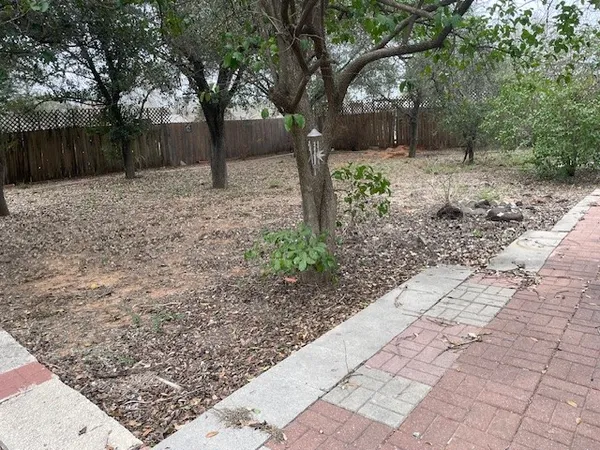 a backyard of a house with lots of green space