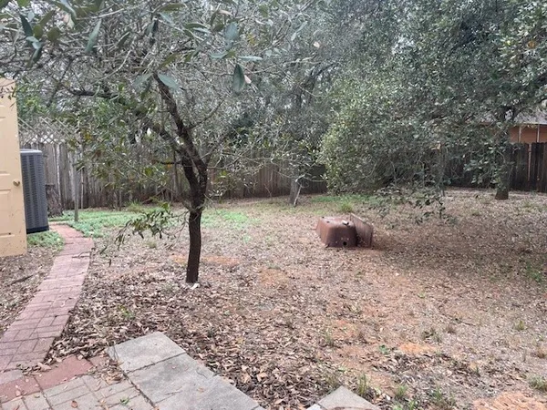 a backyard of a house with lots of green space