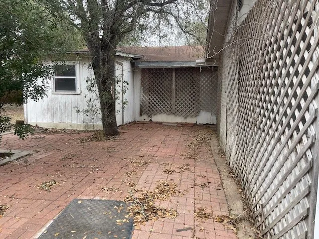 a view of a house with a sink and a yard